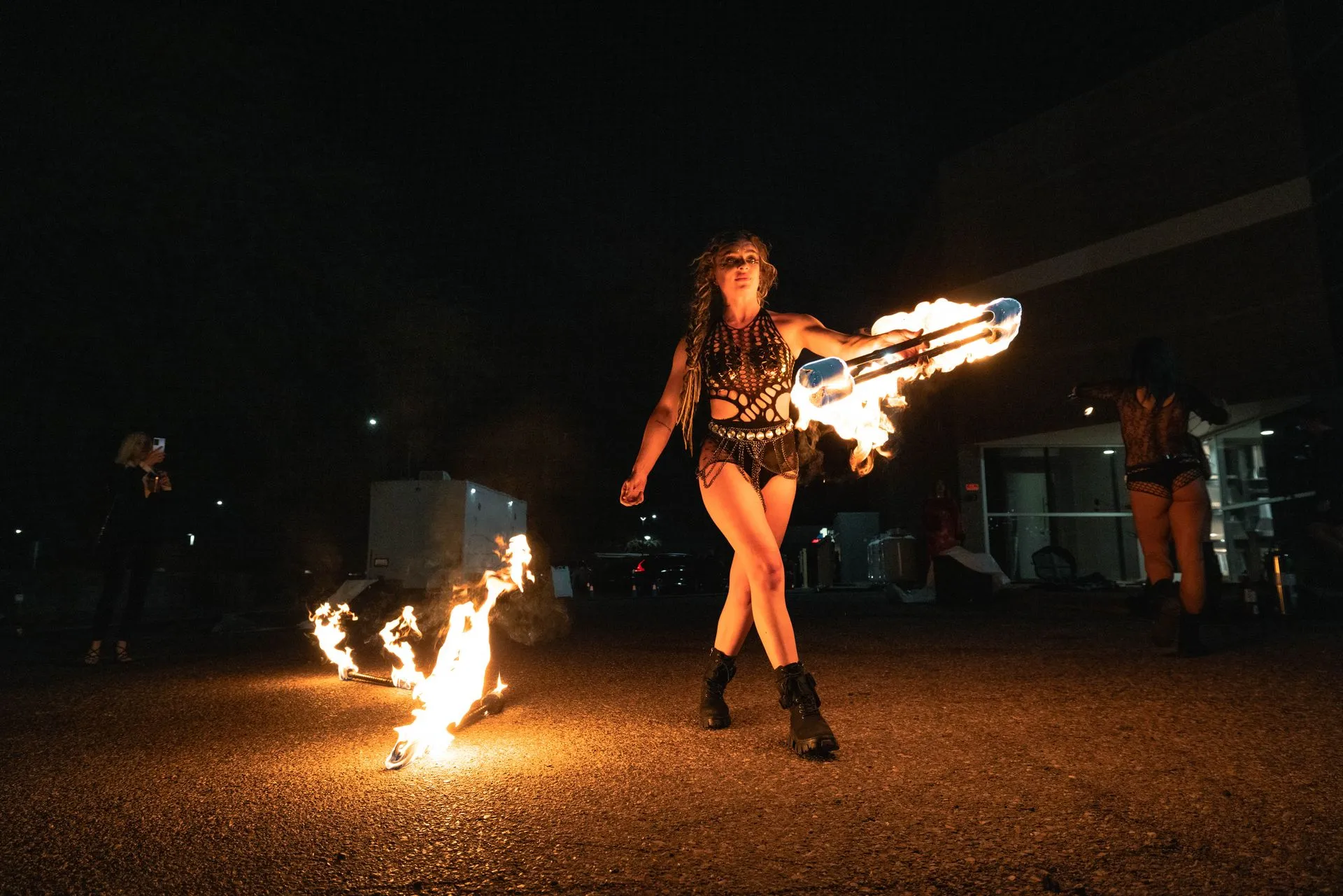 A woman performing with fire.