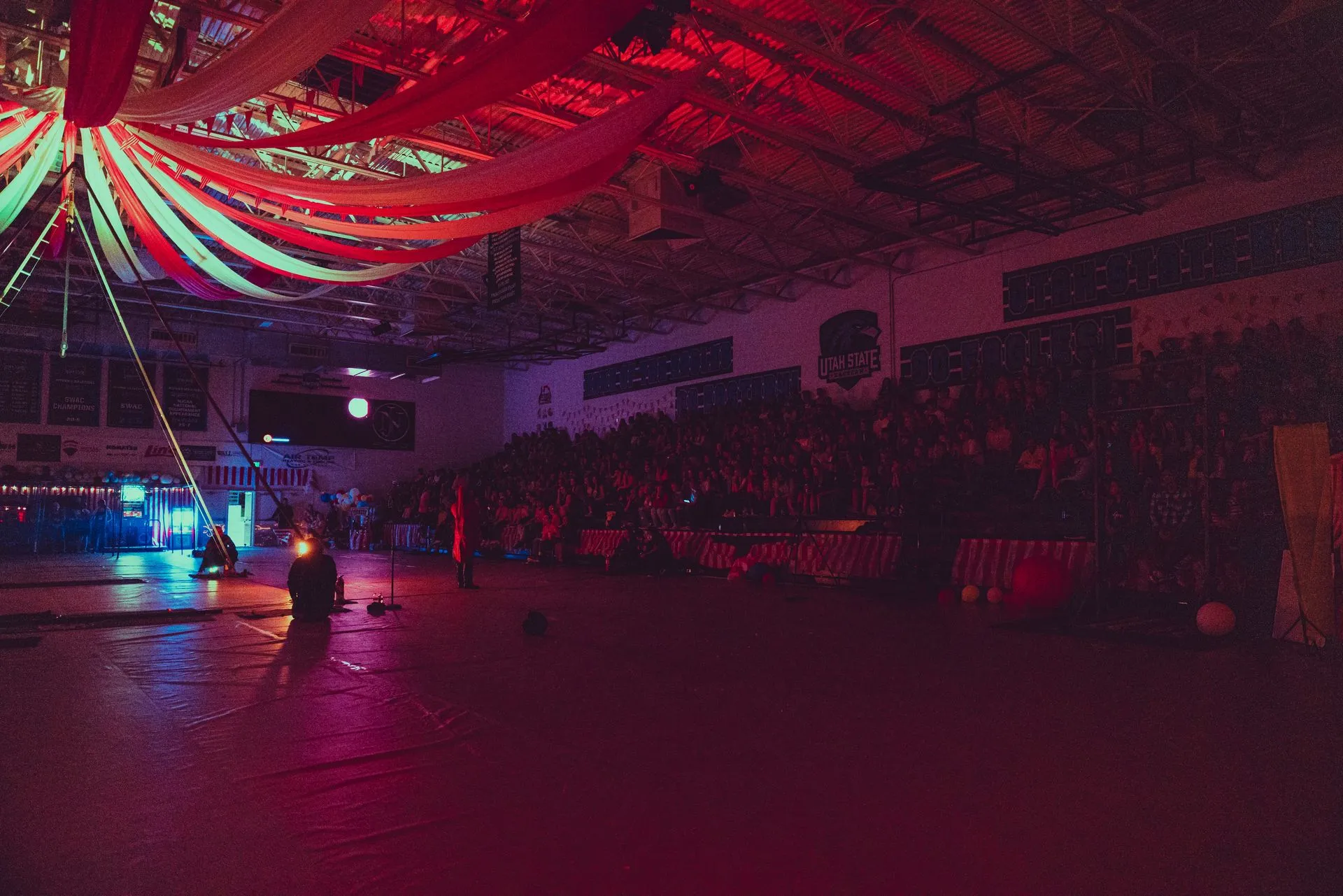 A large empty stadium with a lot of lights on the ceiling.