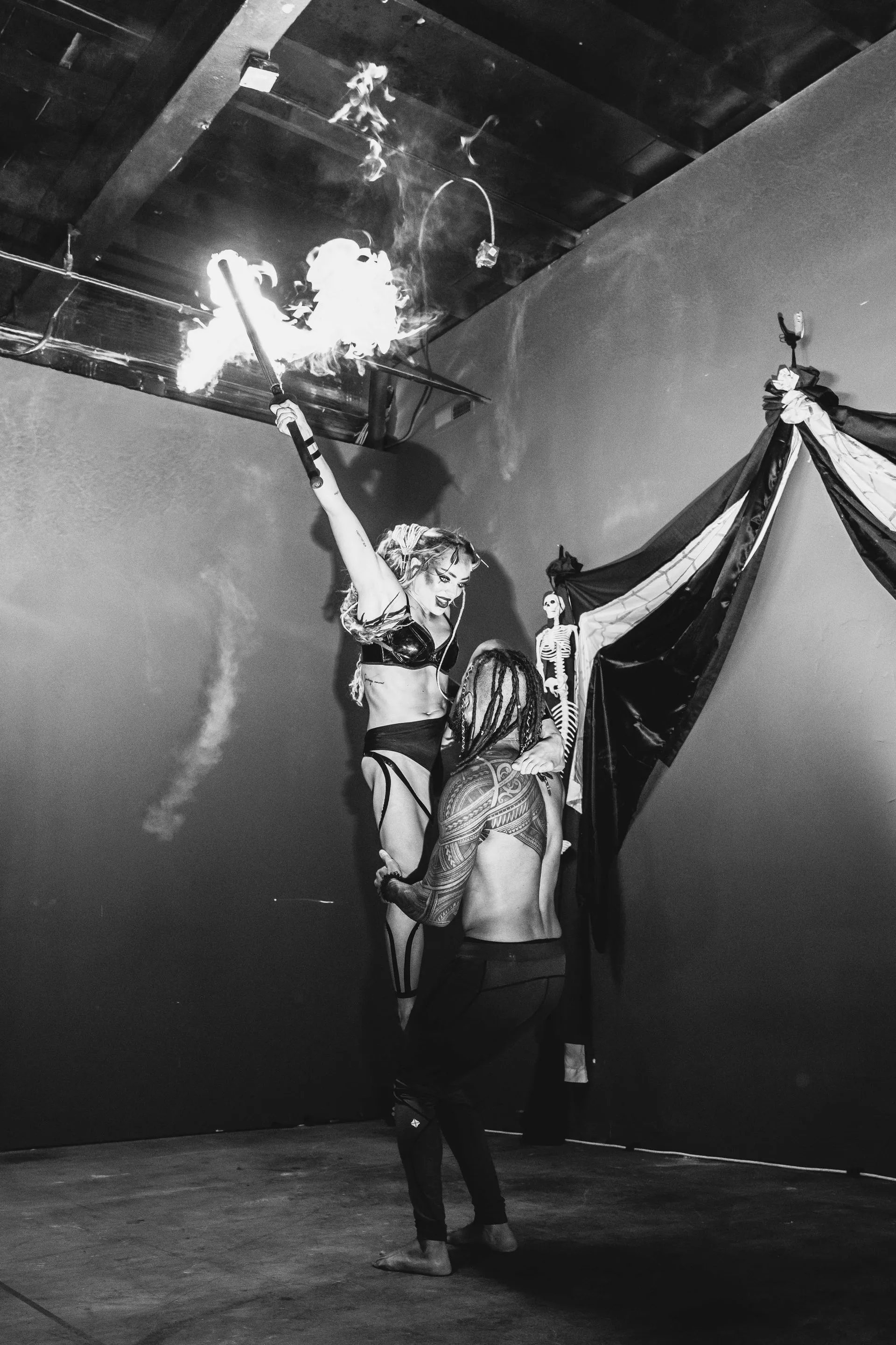 A black and white photo of a person holding a torch