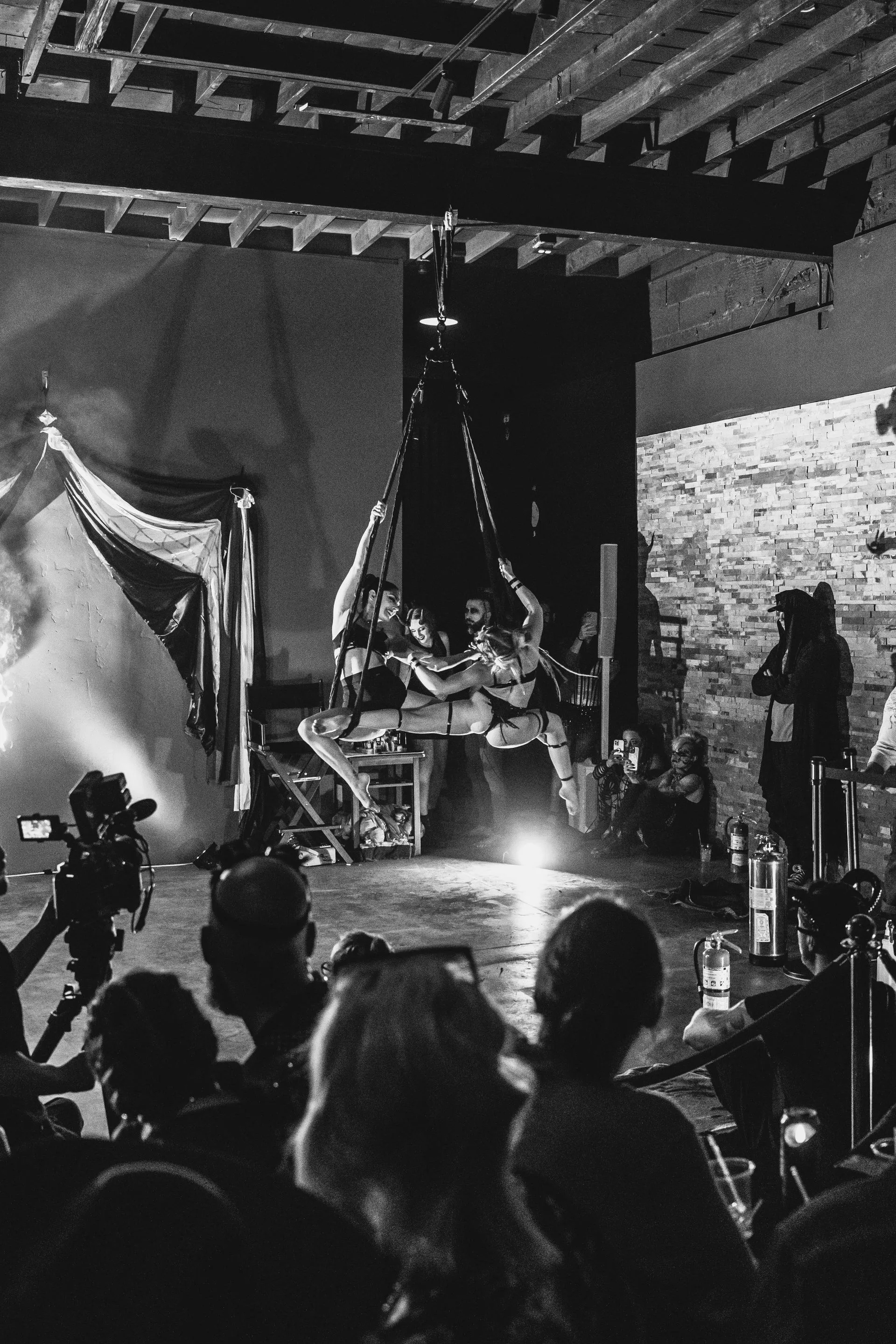 A group of people are watching a performance on stage