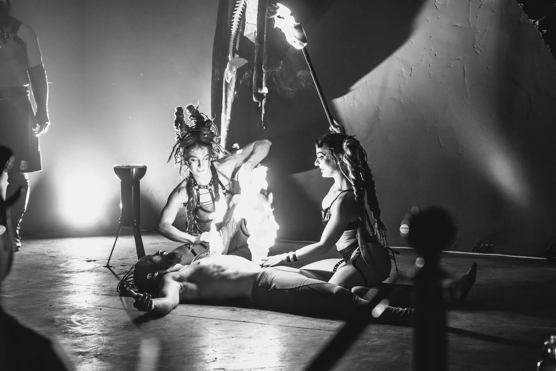 A black and white photo of a man laying on the floor