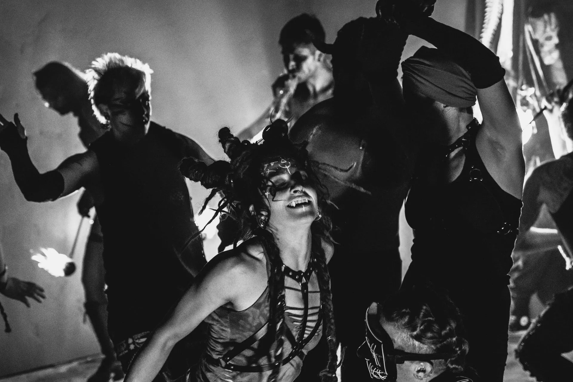 A black and white photo of a group of people dancing