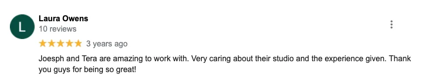 A blurred image of a google review for laura owens