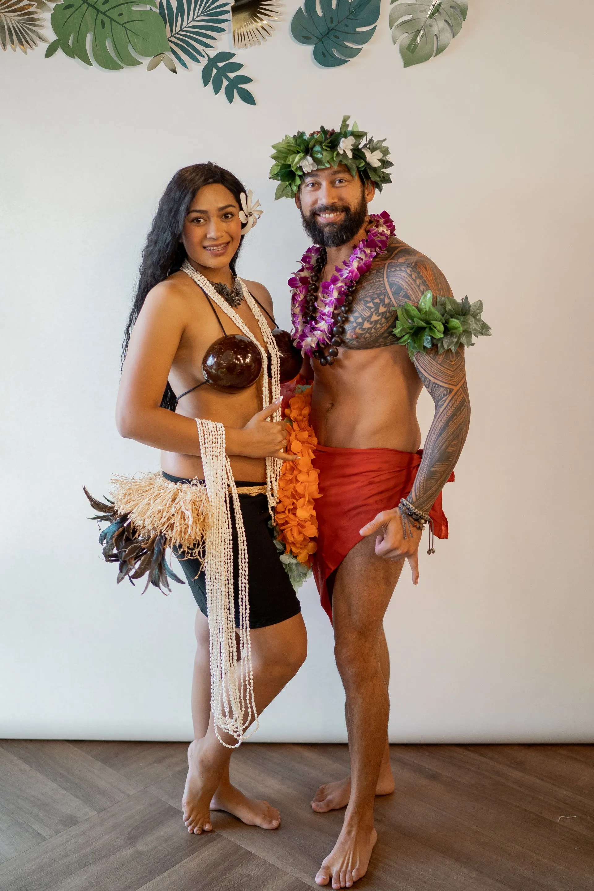 A man and a woman are standing next to each other in a room.
