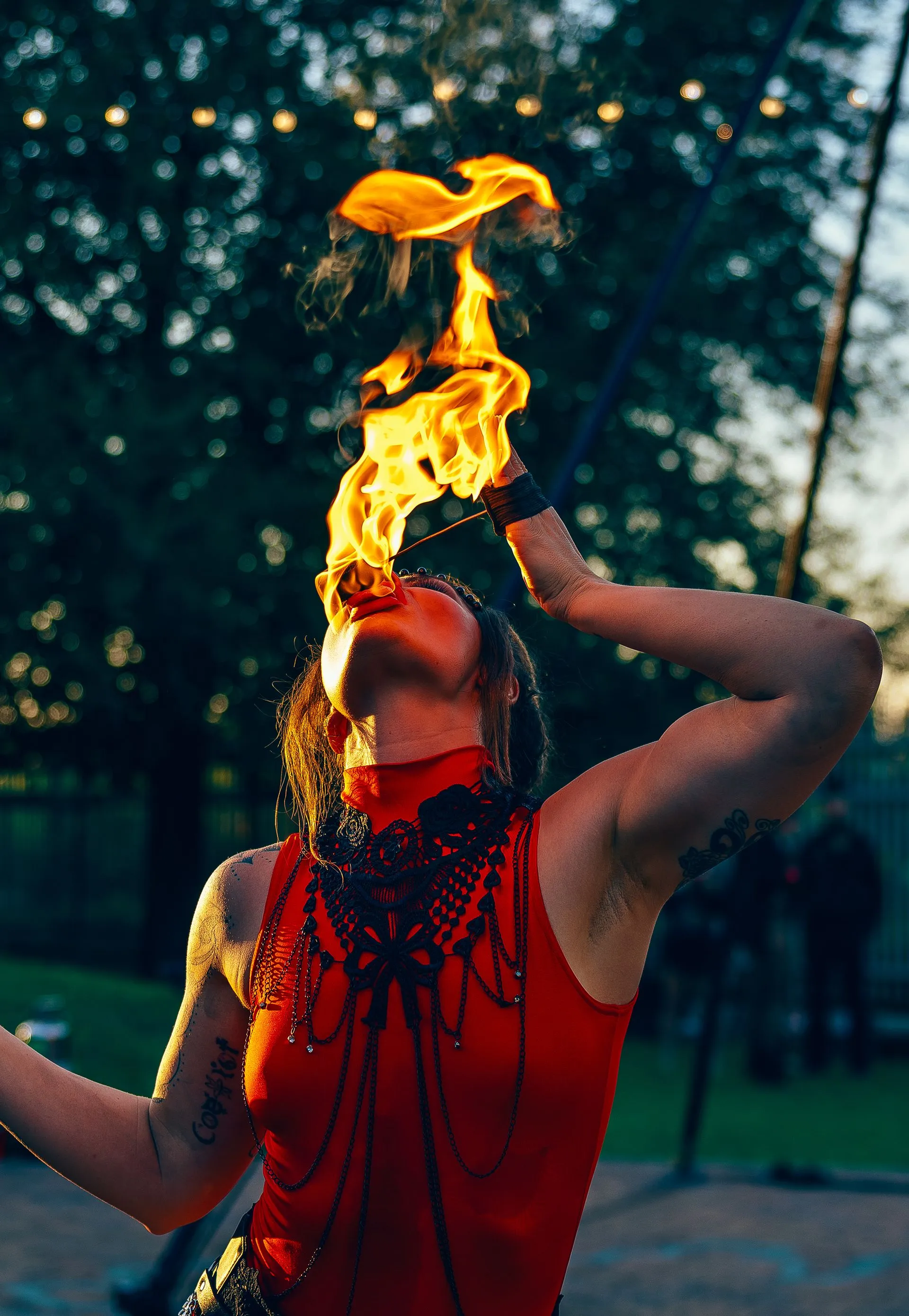 A woman eating fire.