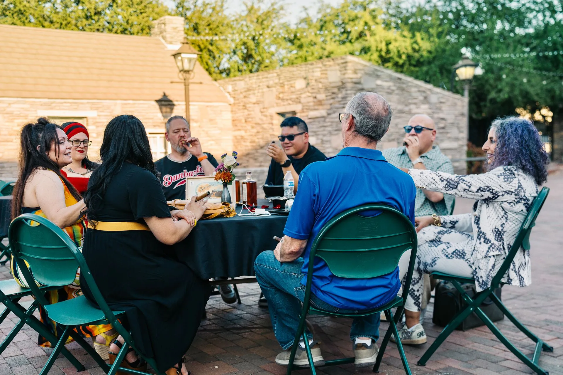 Guests seated together for dinner service at a corporate Cigar Fire Circus event produced by Hana Events