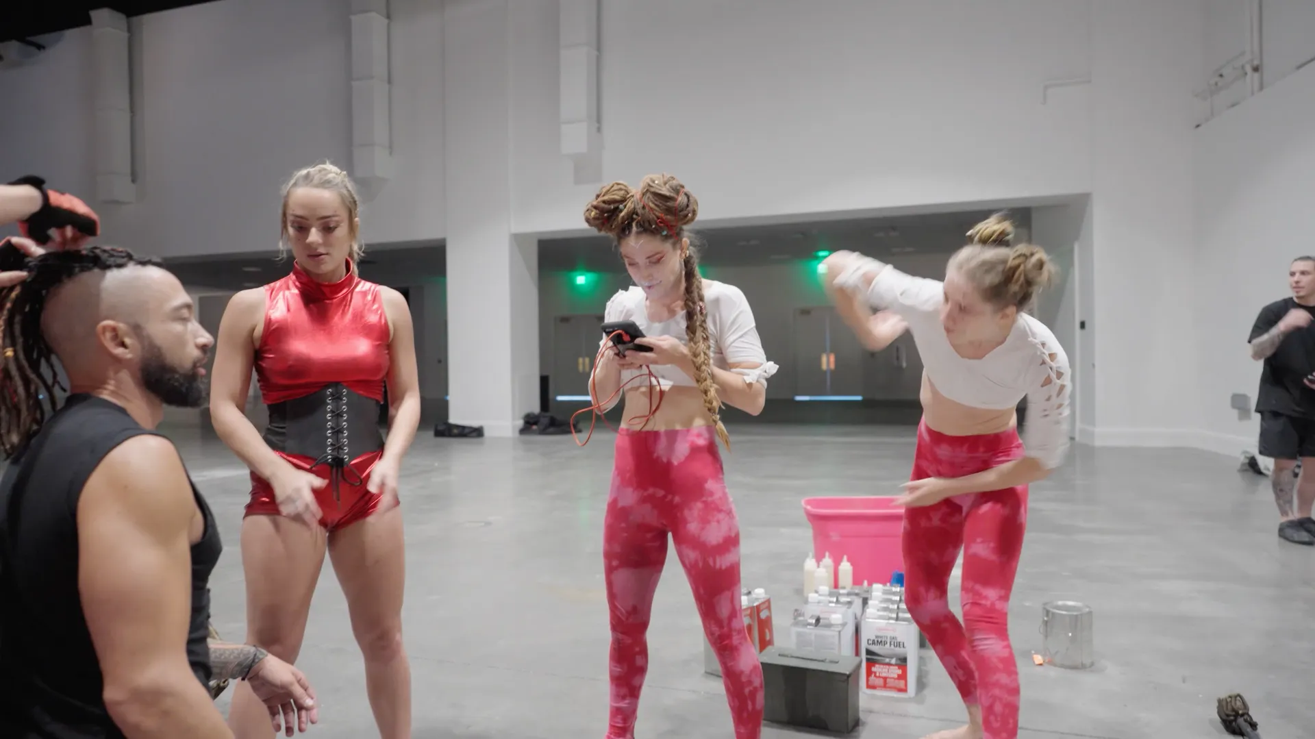 A group of women are standing next to each other in a room.