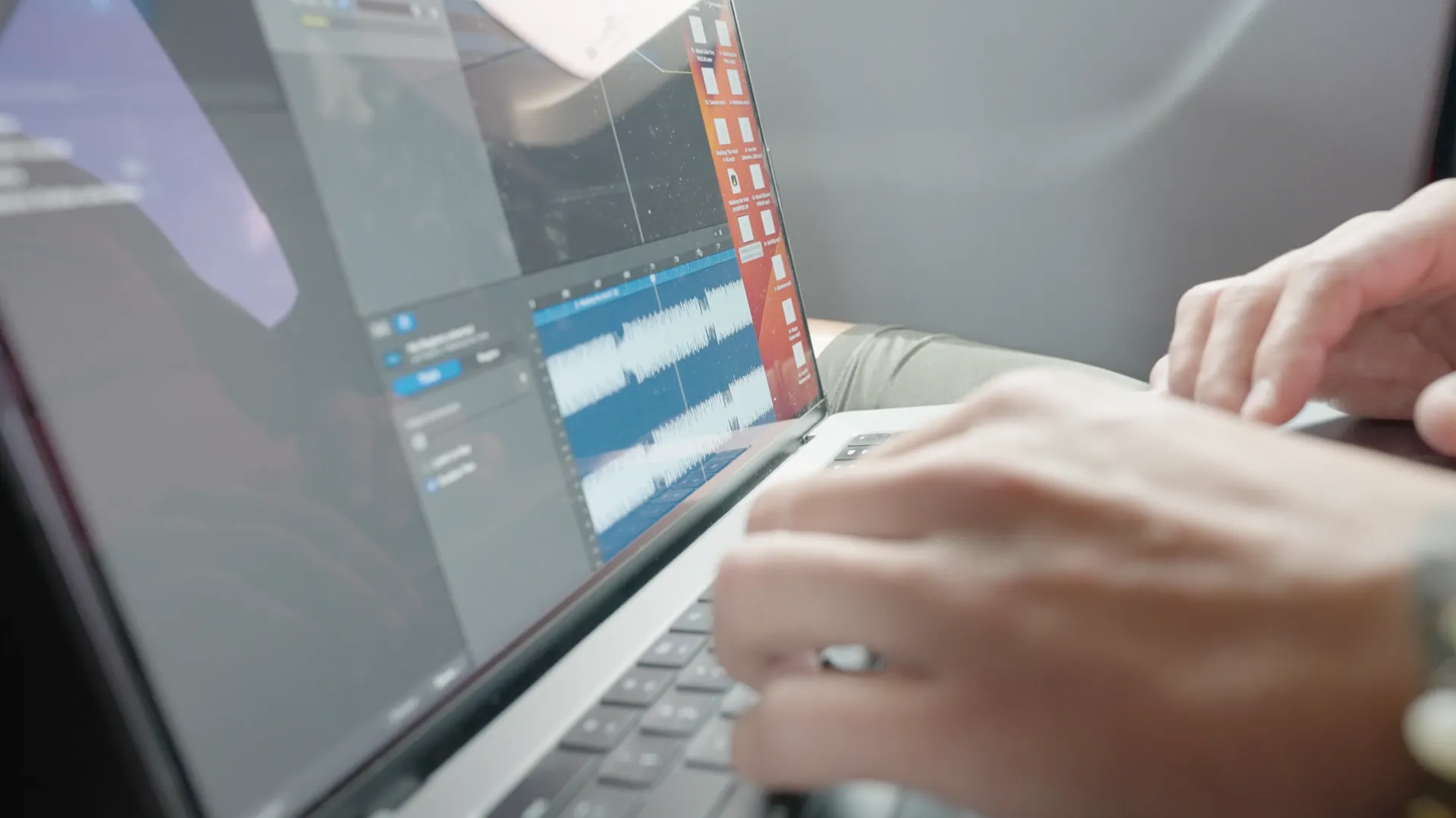 A person is typing on a laptop computer.