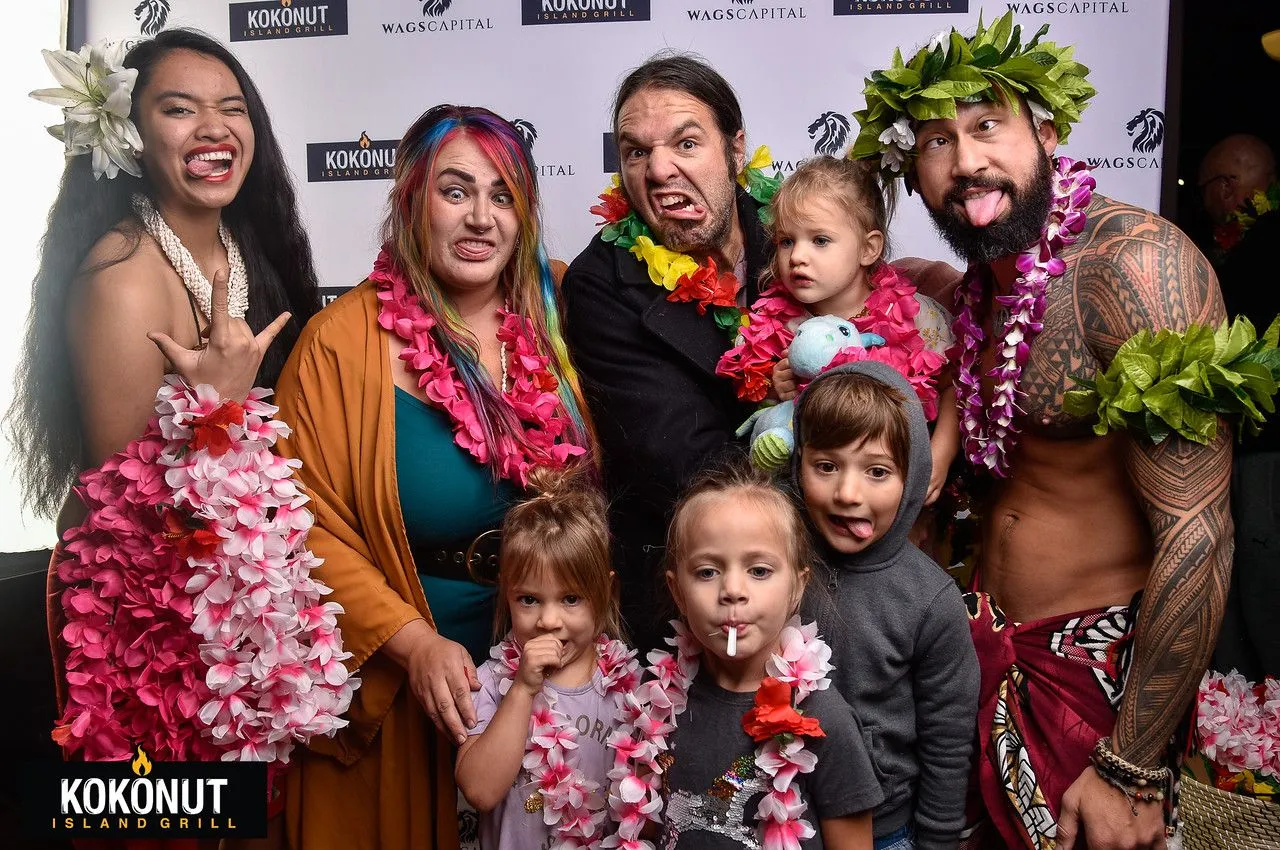 A group of people are posing for a picture together.